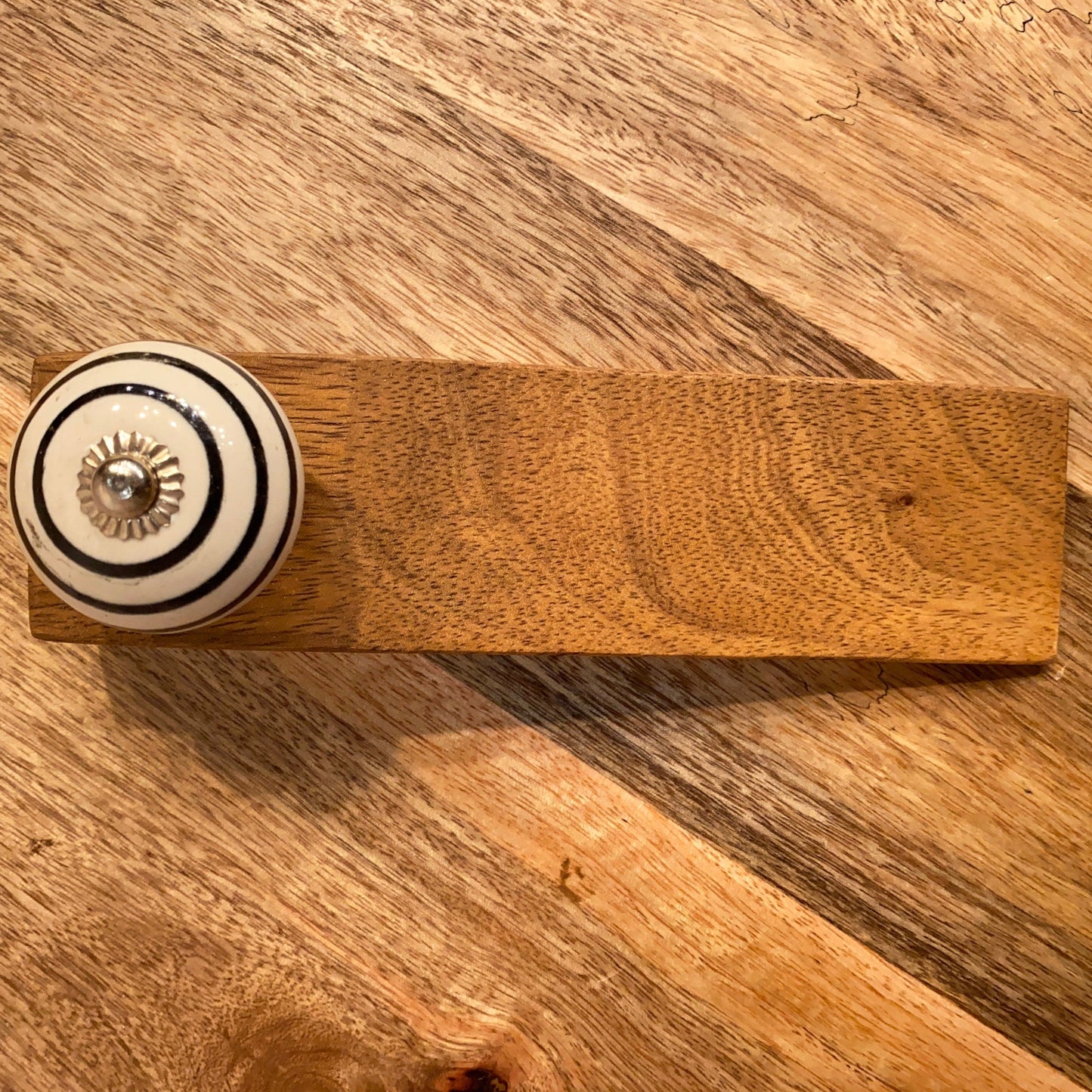 Mango wood door stop wedge. With or without ceramic knob handle. Single from above.