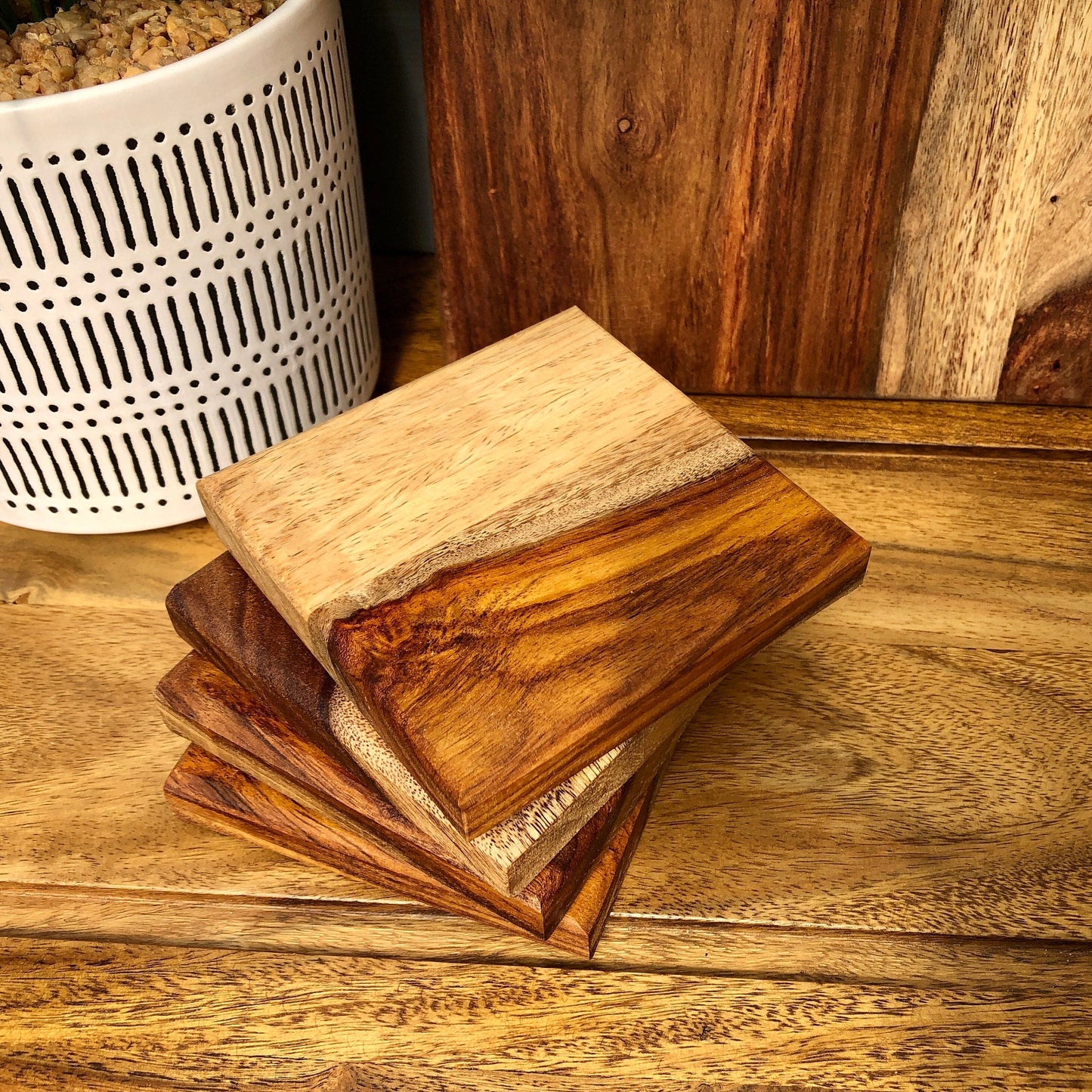 Set of Solid Natural Sheesham Wood Board Placemats & Coasters. Close up of four coasters.
