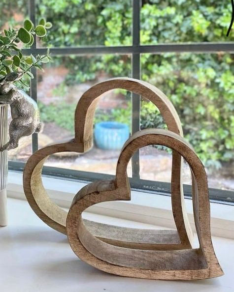 Set of 2 Rustic rough cut Mango wood hearts on a window ledge