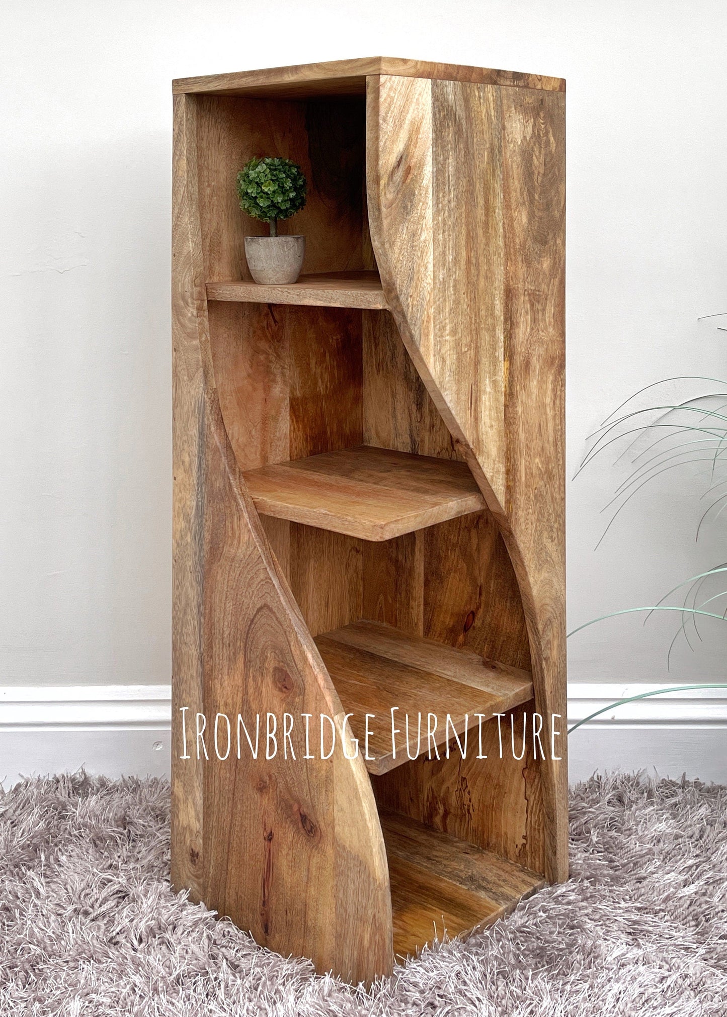 Large Twisted Bookcase. Single bookcase shown with plant.