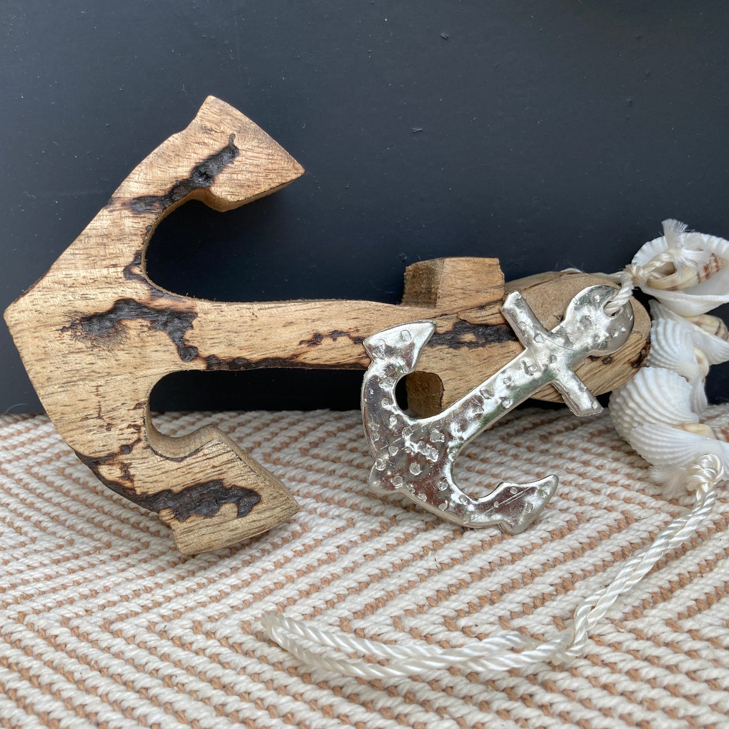 Set of 2 decorative hanging Mango Wood anchors. Laying down.