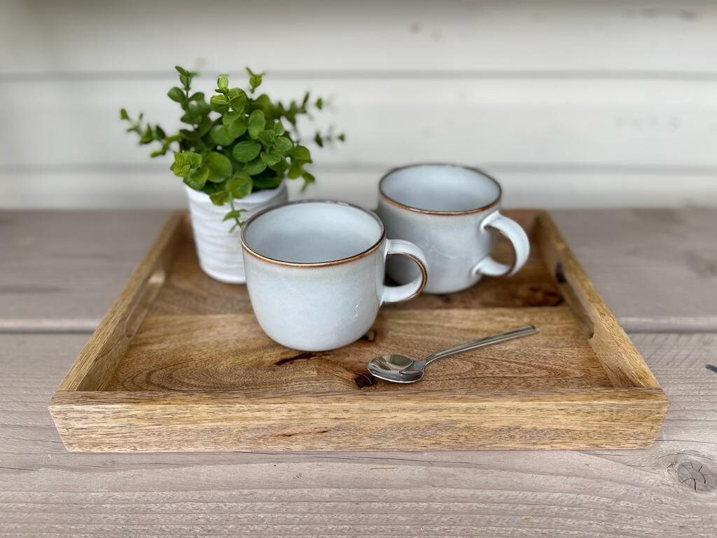 Mango wood straight edge tray with cut out handles. 35x25x4cm as a tea tray