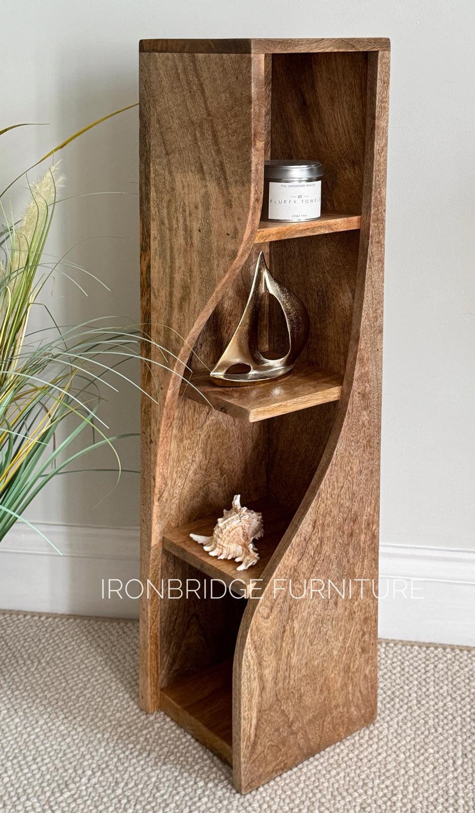 Slim Twisted Mango Wood Bookcase. With items on the shelf.