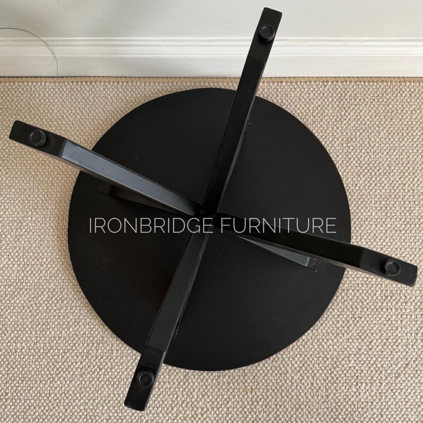 60cm round Mango wood top coffee table with black metal legs. Shown from underneath.