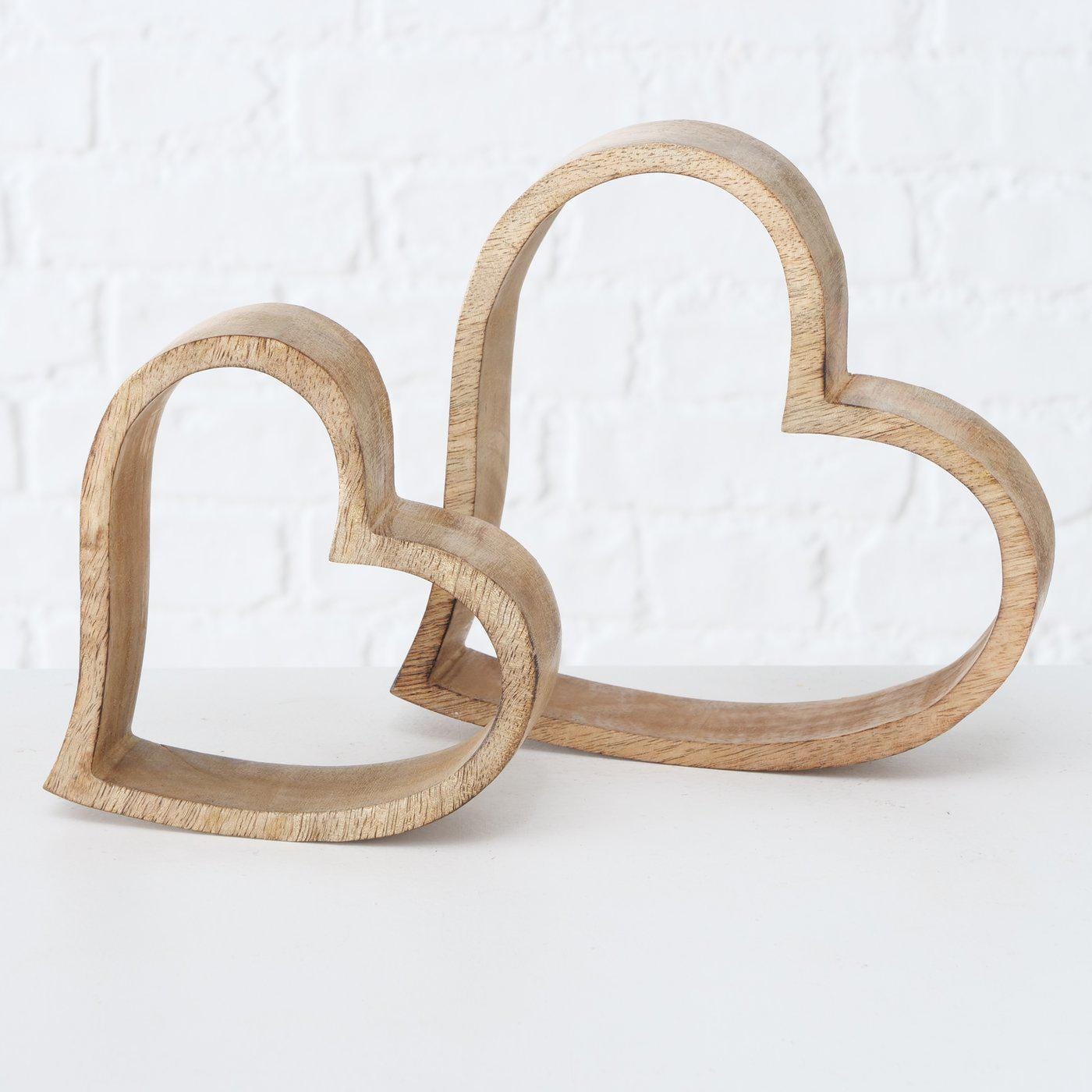 Set of 2 Rustic rough cut Mango wood hearts on a worktop