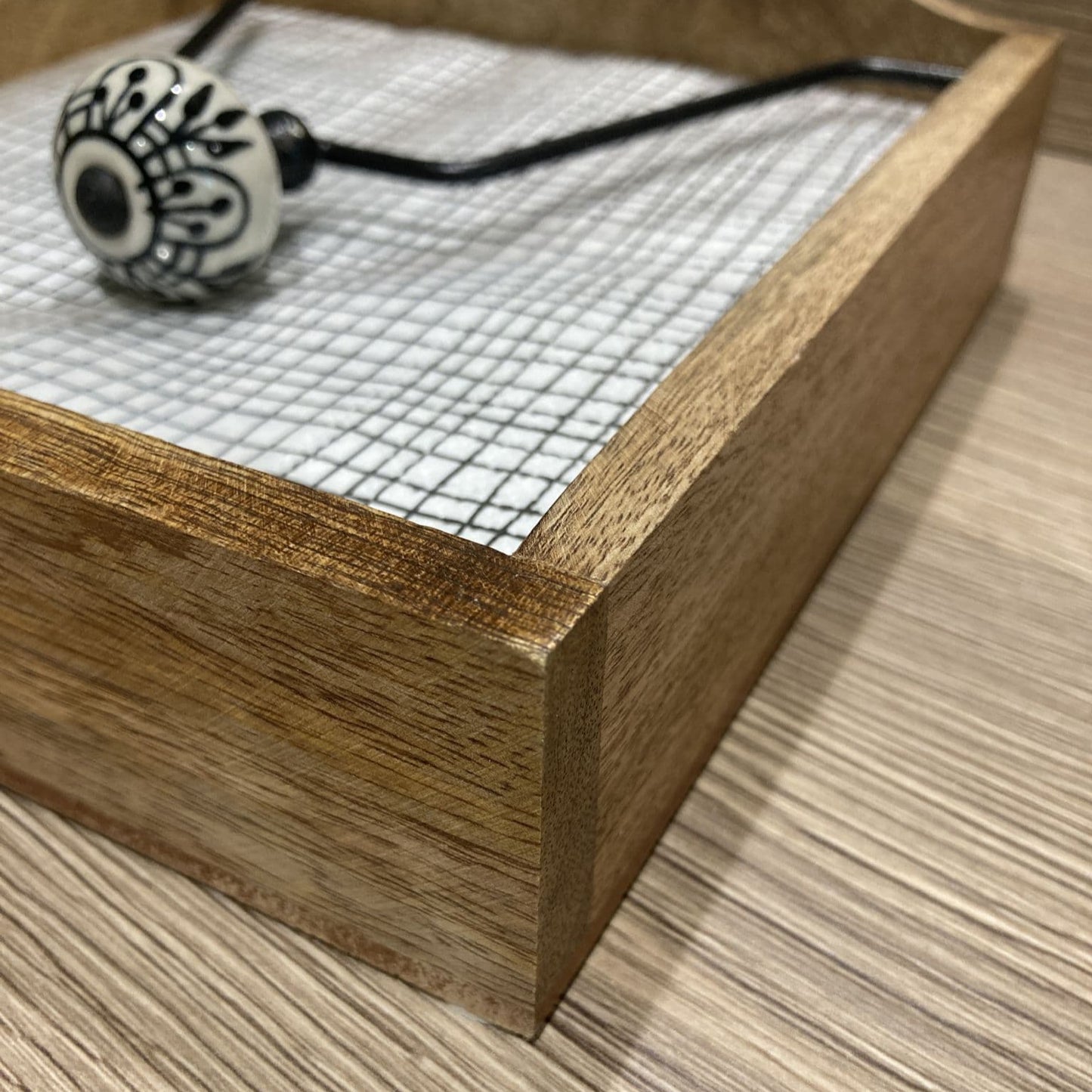 Mango wood napkin holder with ceramic knob weight - close up of holder