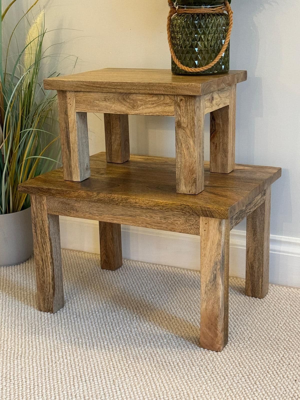 Pair of square finish Mango wood coffee tables stacked at an angle