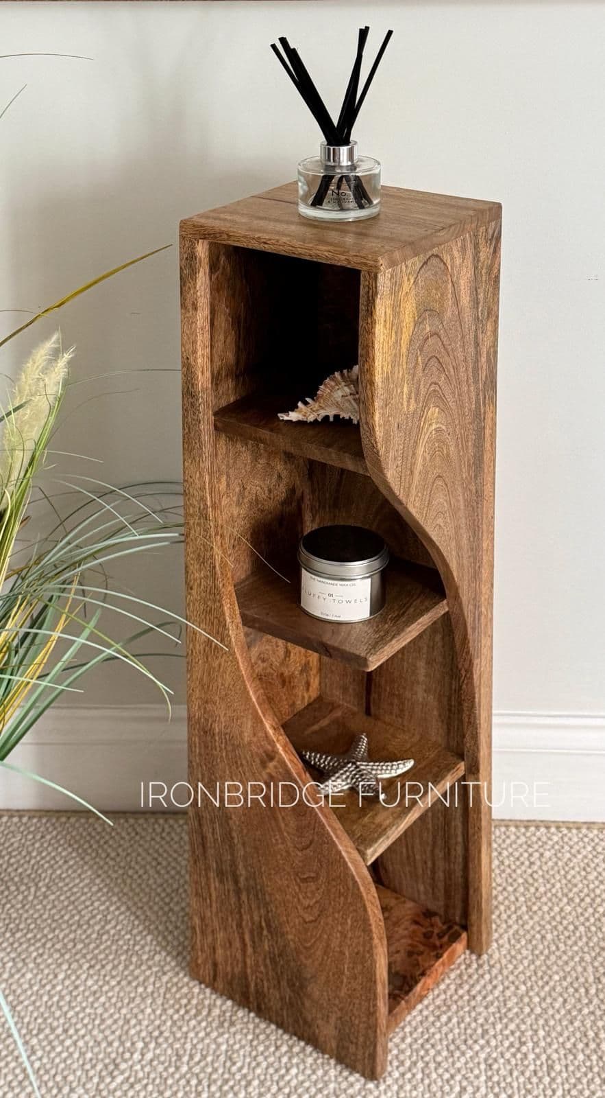 Slim Twisted Mango Wood Bookcase. Shown from the top.