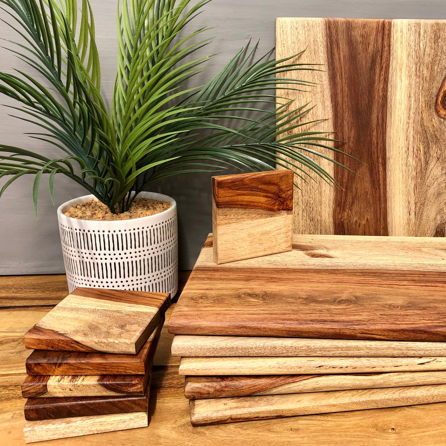 Set of Solid Natural Sheesham Wood Board Placemats & Coasters. Stacked coasters and placemats.