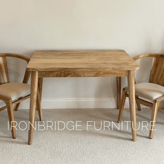 100 x 70cmSquare Mango dining table with cone shaped legs in a dining room
