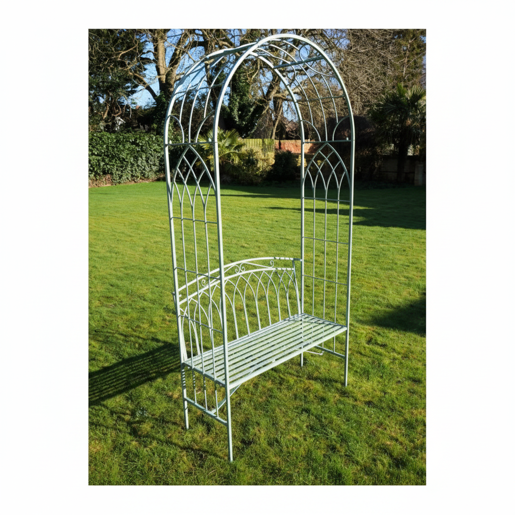 Metal garden arch with bench on a grassy area