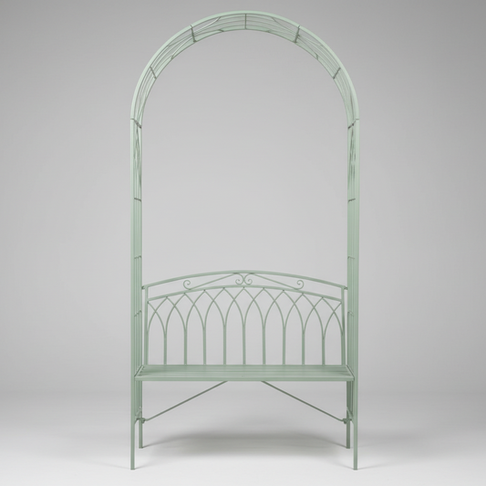 Metal garden archway in a park with a fountain in the background