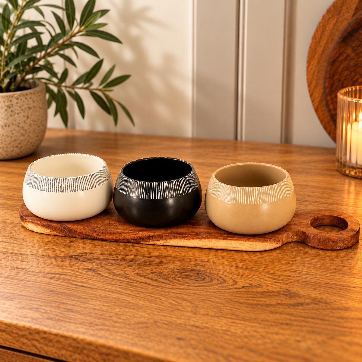 Set of 3 tapas bowls on an Acacia wood serving paddle.