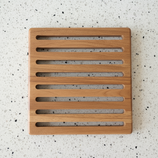 Wooden hotplate with slatted design on a white background