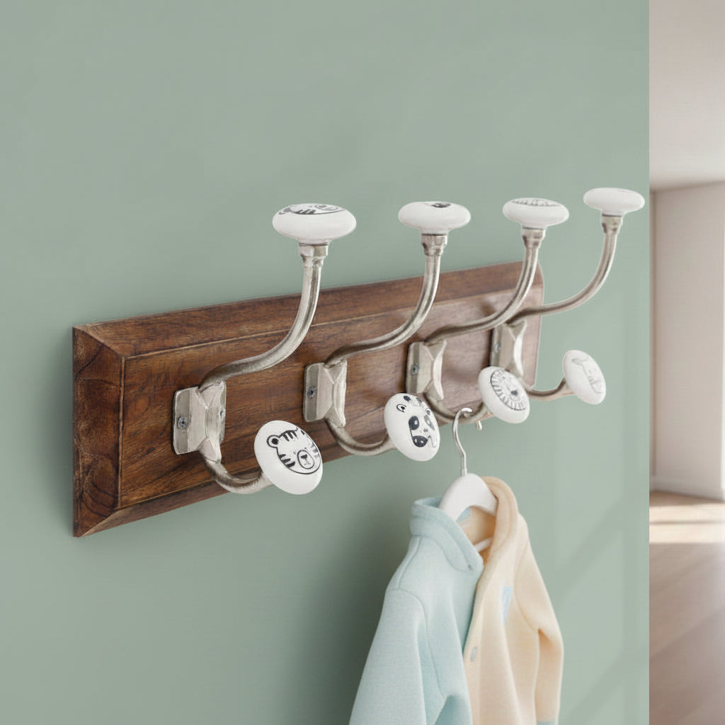 Wooden coat rack with four hooks on a white background