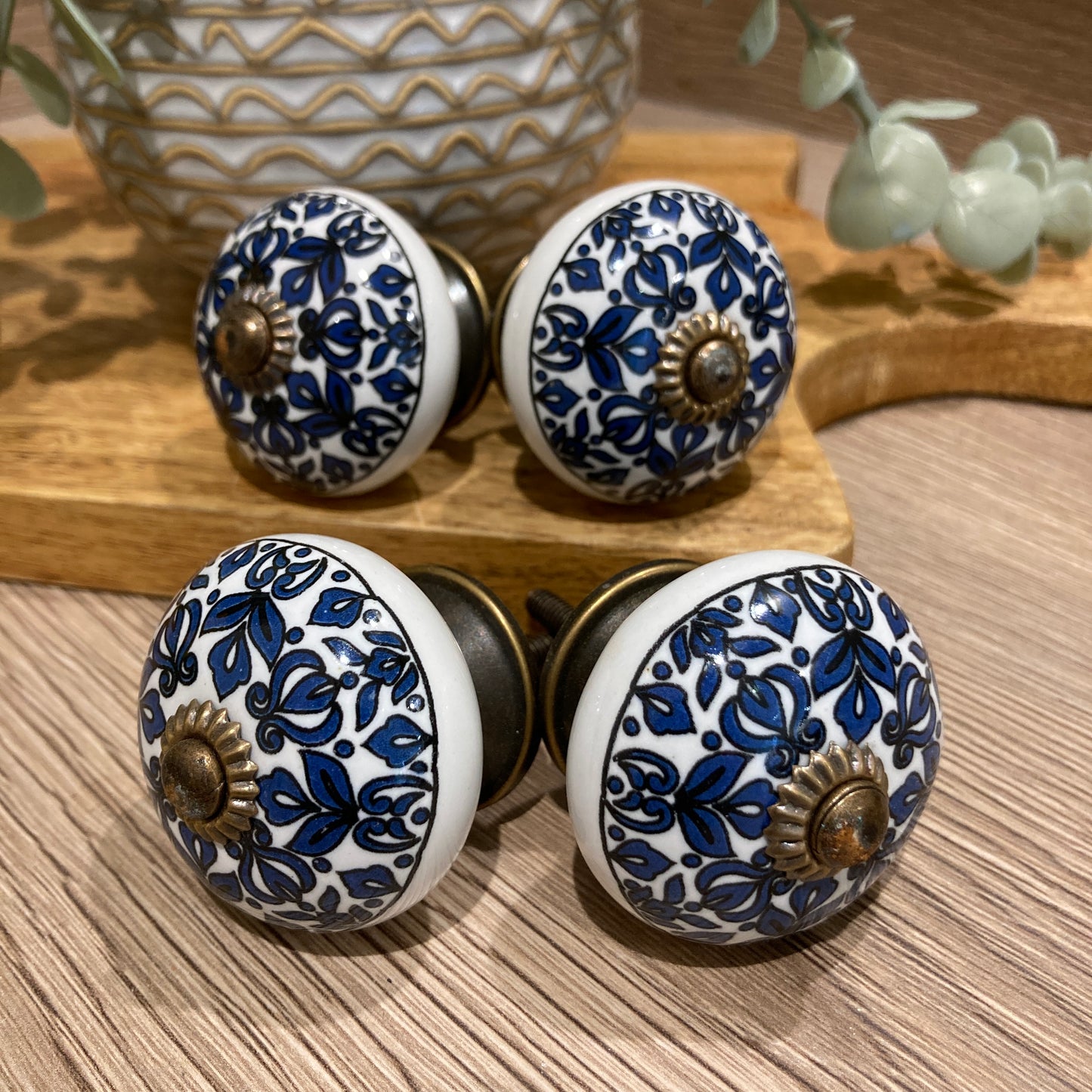 Set of 4 hand painted ceramic knob handles. Knobs pointing outwards.