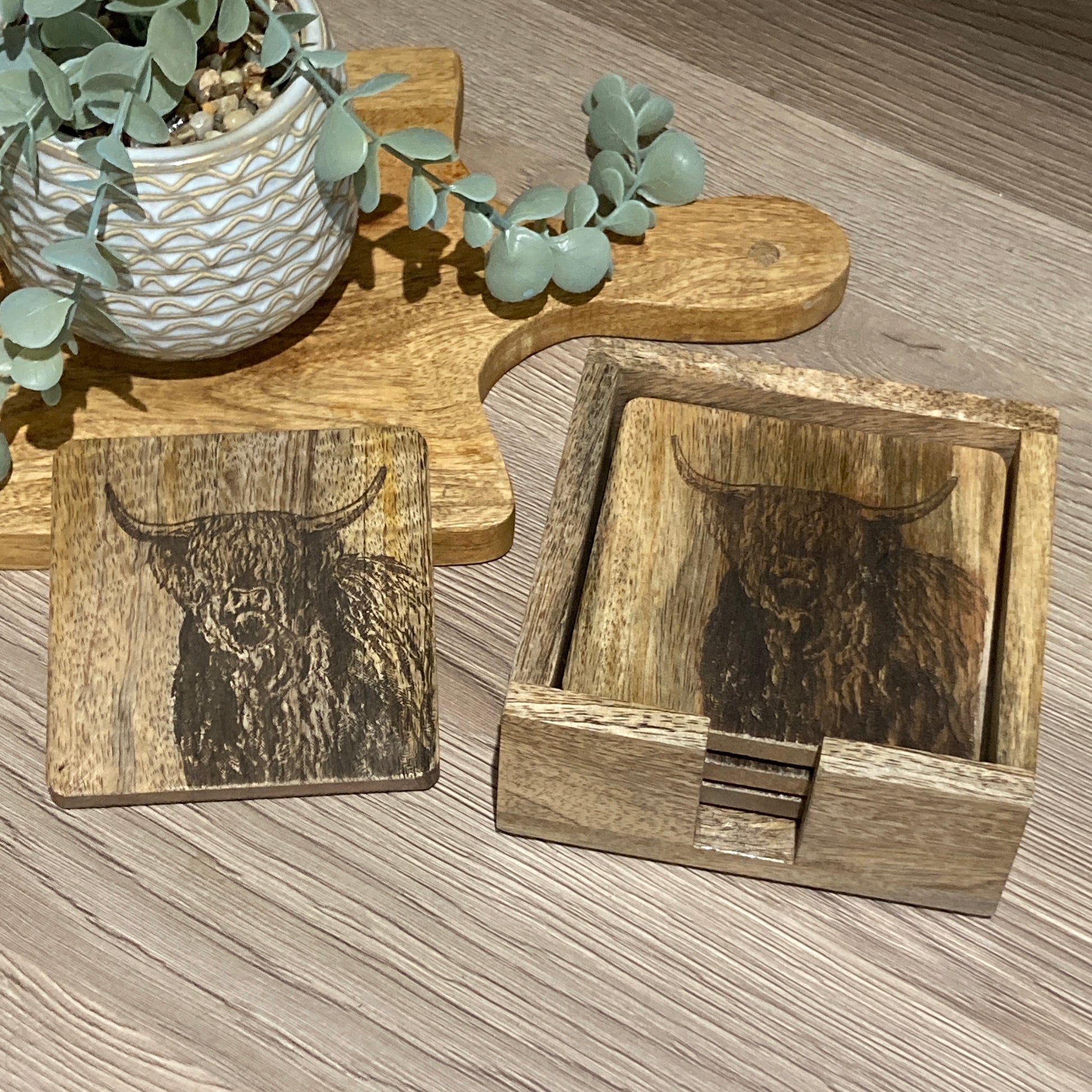 Set of 4 Mango wood square coasters with holder. 10cm square - Etched with Highland cow. One coaster on table. 