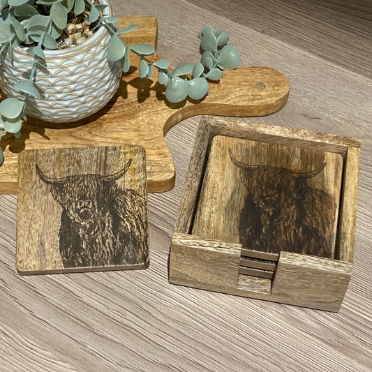 Set of 4 Mango wood square coasters with holder. 10cm square - Etched with Highland cow. One coaster on table. 