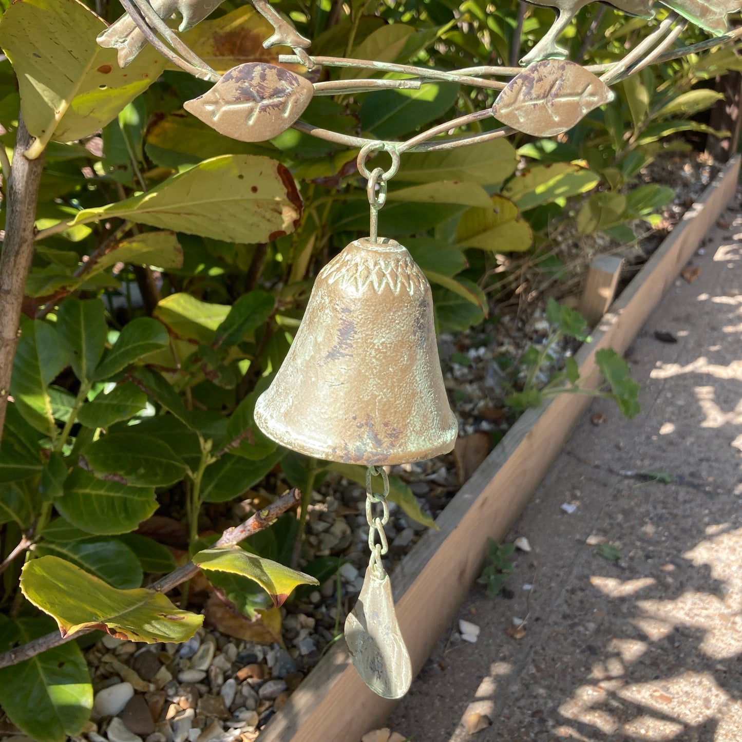 Hanging bird wind chime / bell. Bell shown in the bush. 