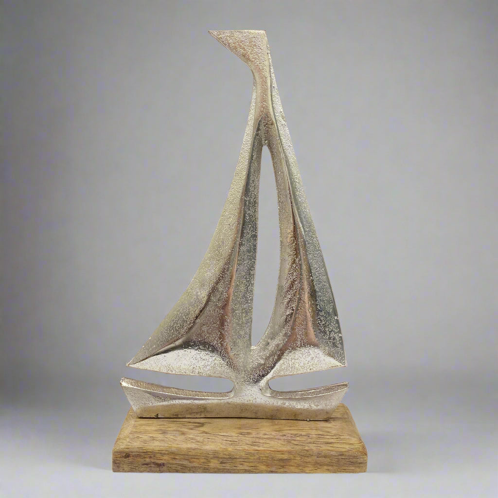 Cast aluminium sailing yachts on Mango wood base. 2 sizes available. Single boat shown. 