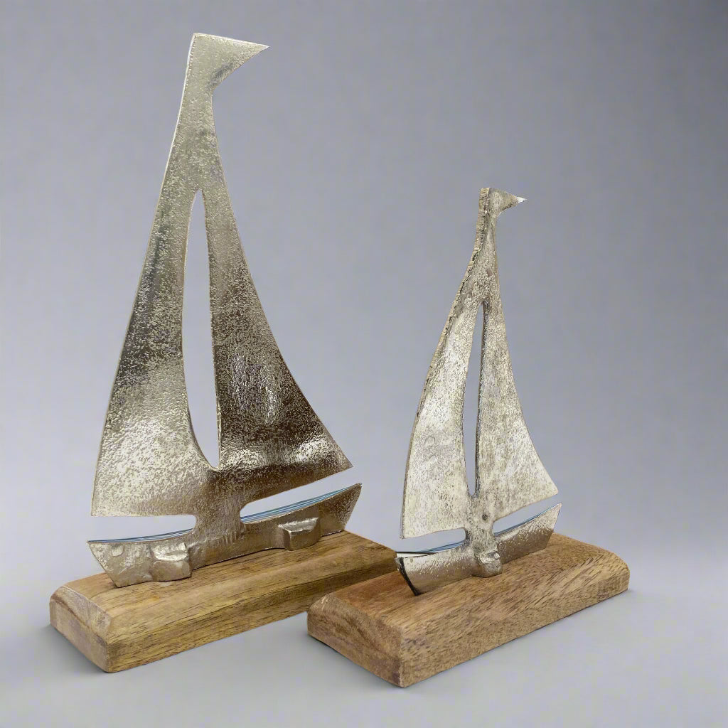 Cast aluminium sailing yachts on Mango wood base. 2 sizes available. Shown at an angle. 
