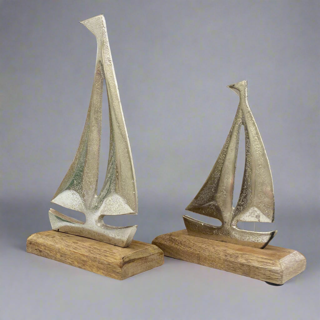 Cast aluminium sailing yachts on Mango wood base. 2 sizes available. Shown at an angle. 