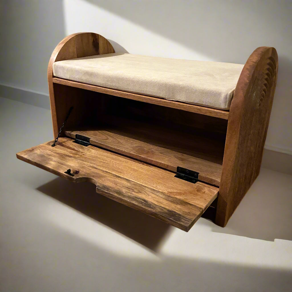 Wooden bench with storage compartment on a wooden floor.