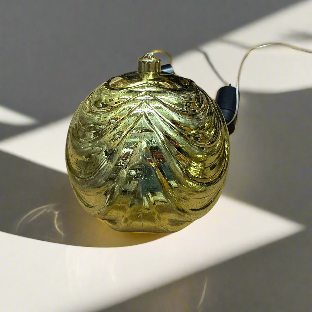 Gold decorative ornament on a concrete floor