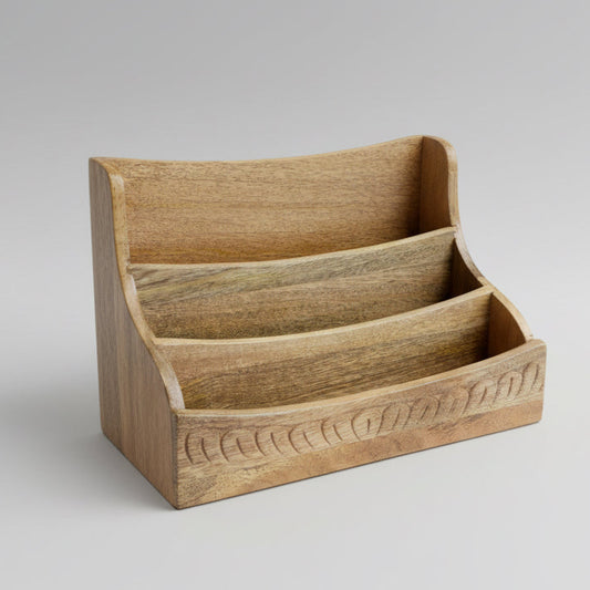 Wooden magazine rack on a concrete floor