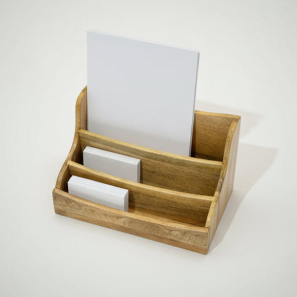 Wooden card holder with business cards on a light gray background