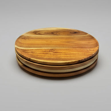 Stack of wooden cutting boards on a kitchen counter