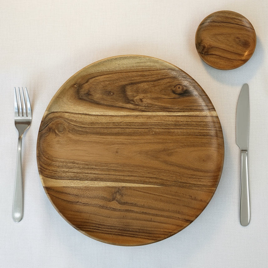 Wooden cutting board with knife and fork on a white background
