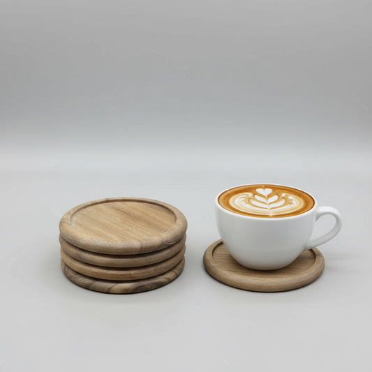 Stack of wooden coasters on a cardboard surface