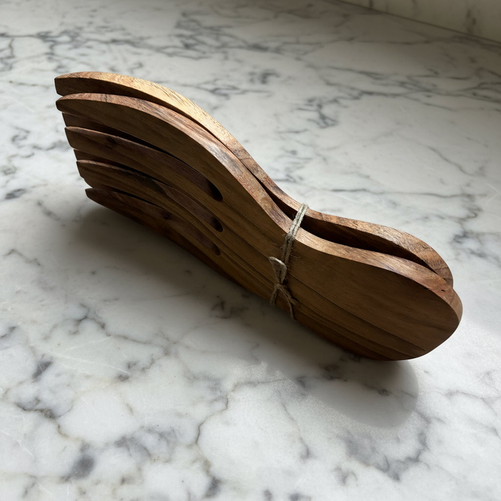 Wooden sandal sole on a gray surface