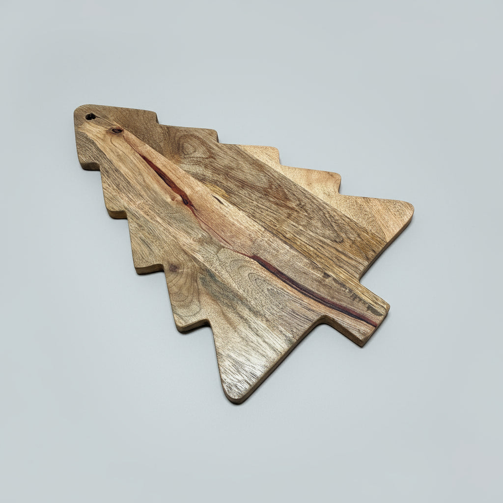 Wooden cutting board shaped like a fish on a wooden floor