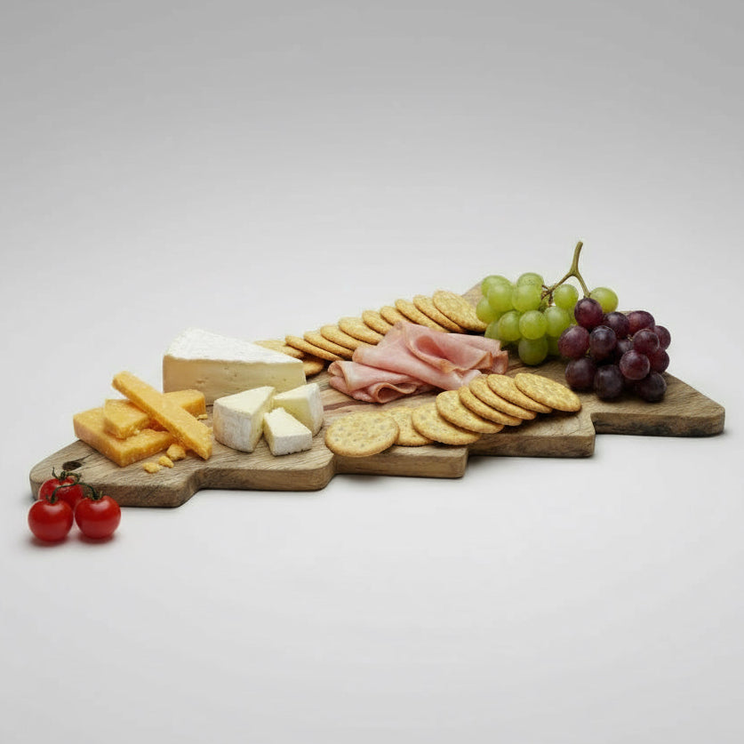 Wooden cutting board shaped like a fish on a wooden floor