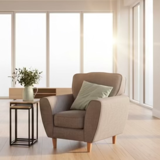 Modern living room with a brown armchair and small table near large windows.