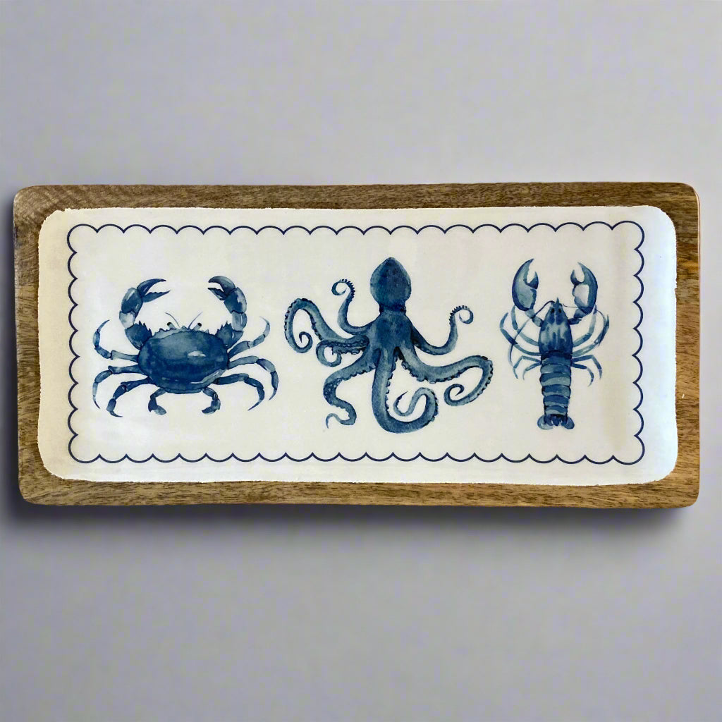 Decorative tray with blue sea creature illustrations on a white background