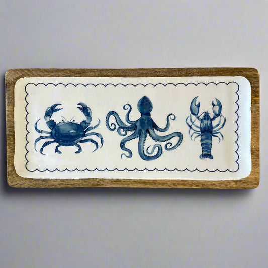 Decorative tray with blue sea creature illustrations on a white background