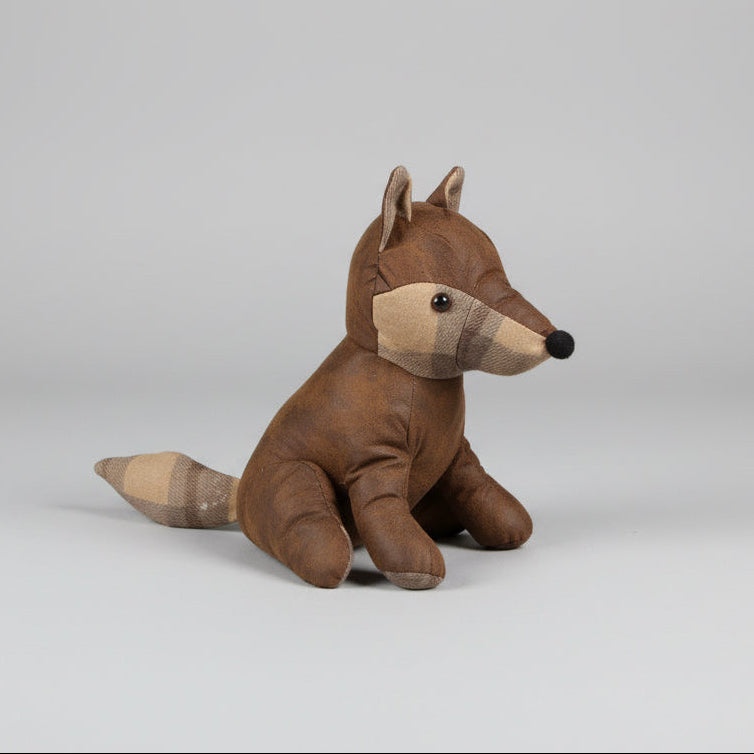 Brown stuffed animal toy on a concrete floor
