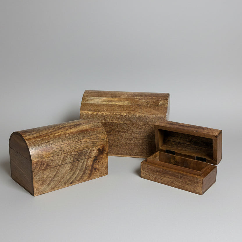 Wooden cylindrical objects and a small box on a wooden surface