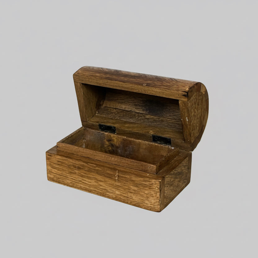 Wooden jewelry box on a wooden surface
