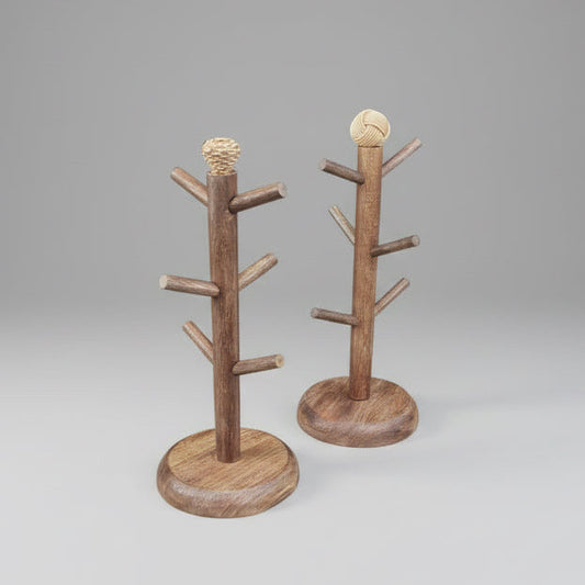 Two wooden coat racks on a wooden block with a workshop background