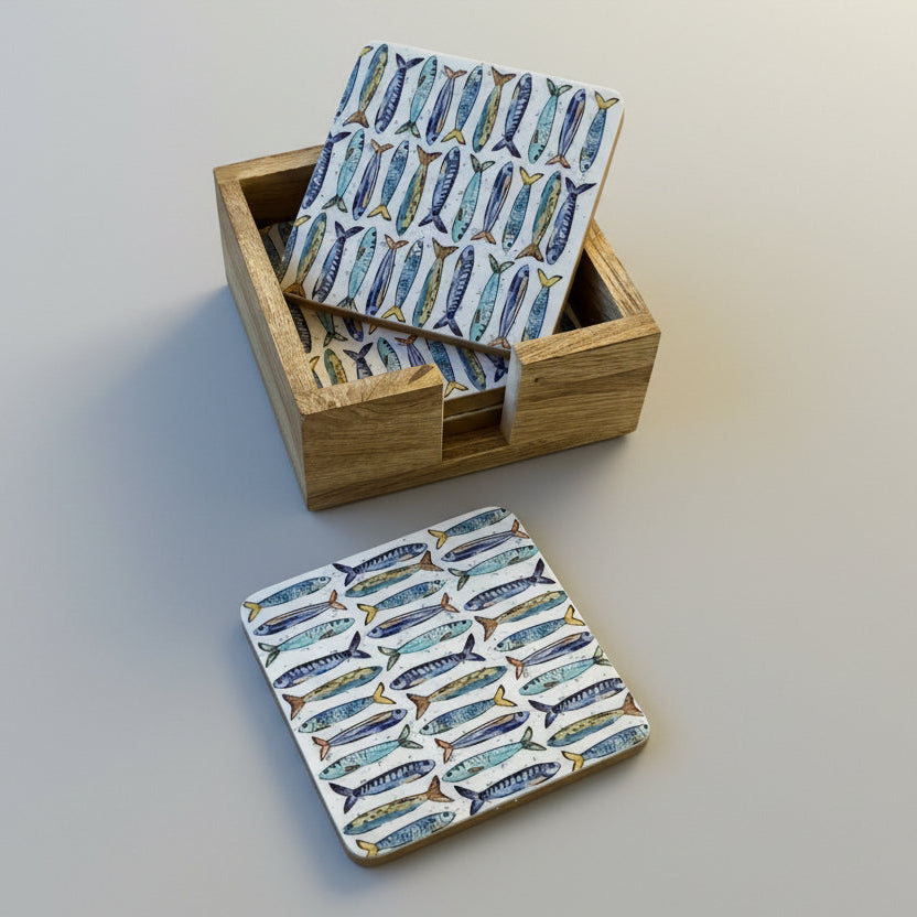 Coasters with fish pattern in a wooden box on a wooden surface