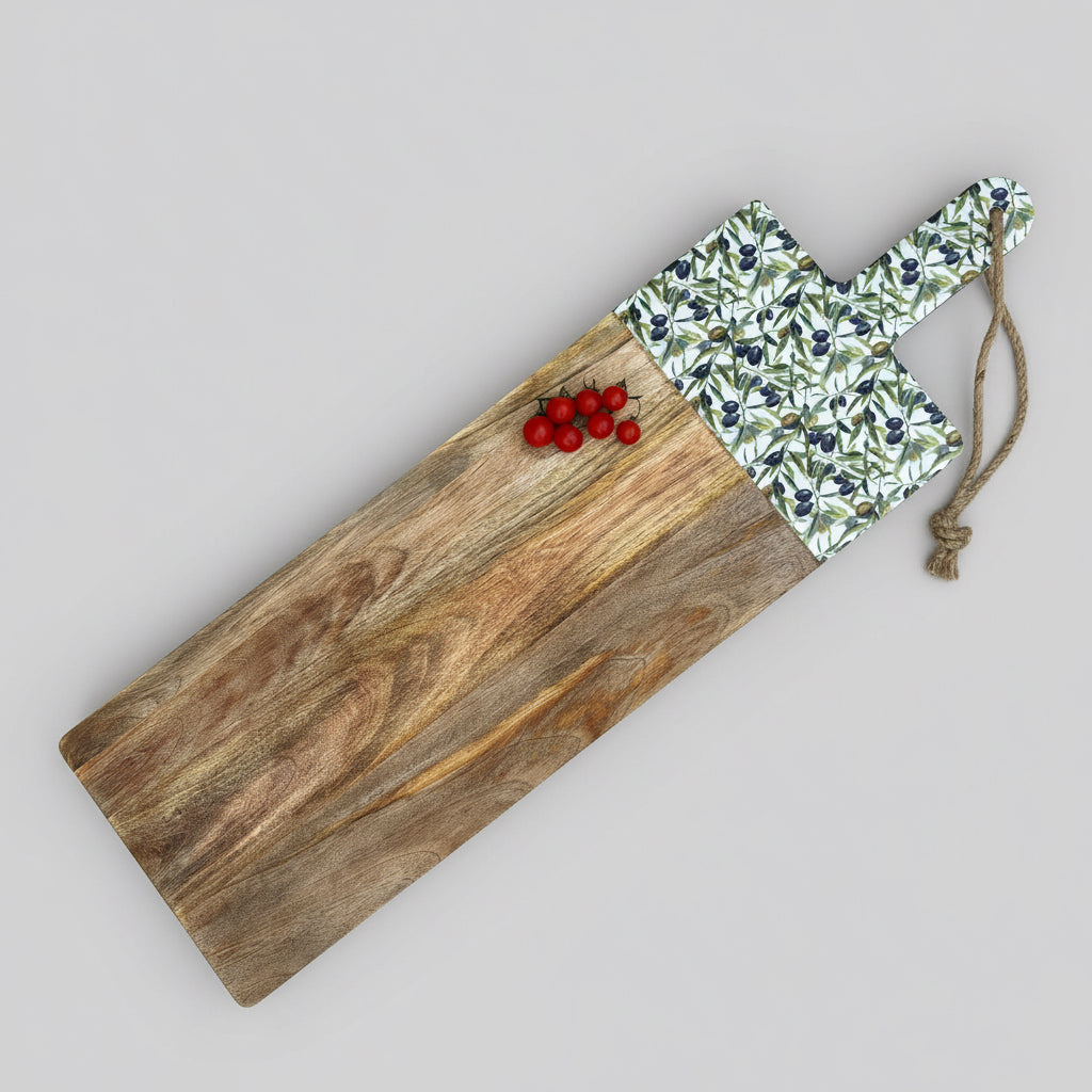 Wooden cutting board with a floral patterned handle on a gray wooden floor.