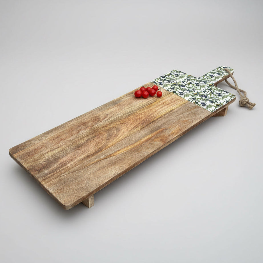 Wooden cutting board with tomatoes on a gray wooden floor