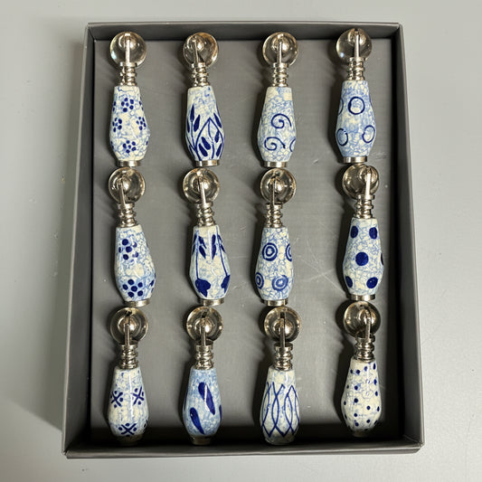 Set of decorative items with blue and white patterns in a box