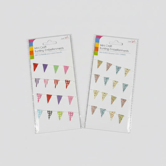 Two packages of mini craft bunting embellishments on a black background
