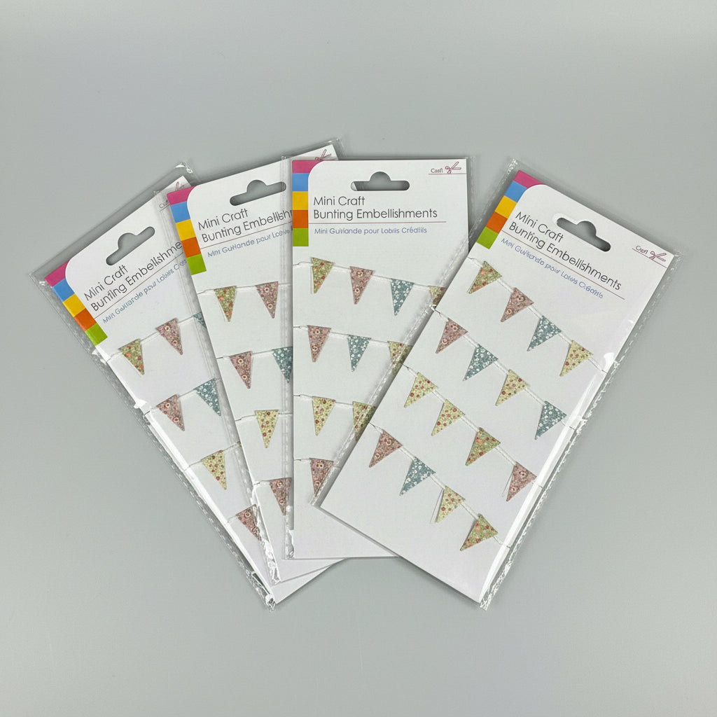 Packaged mini craft bunting embellishments on a dark background