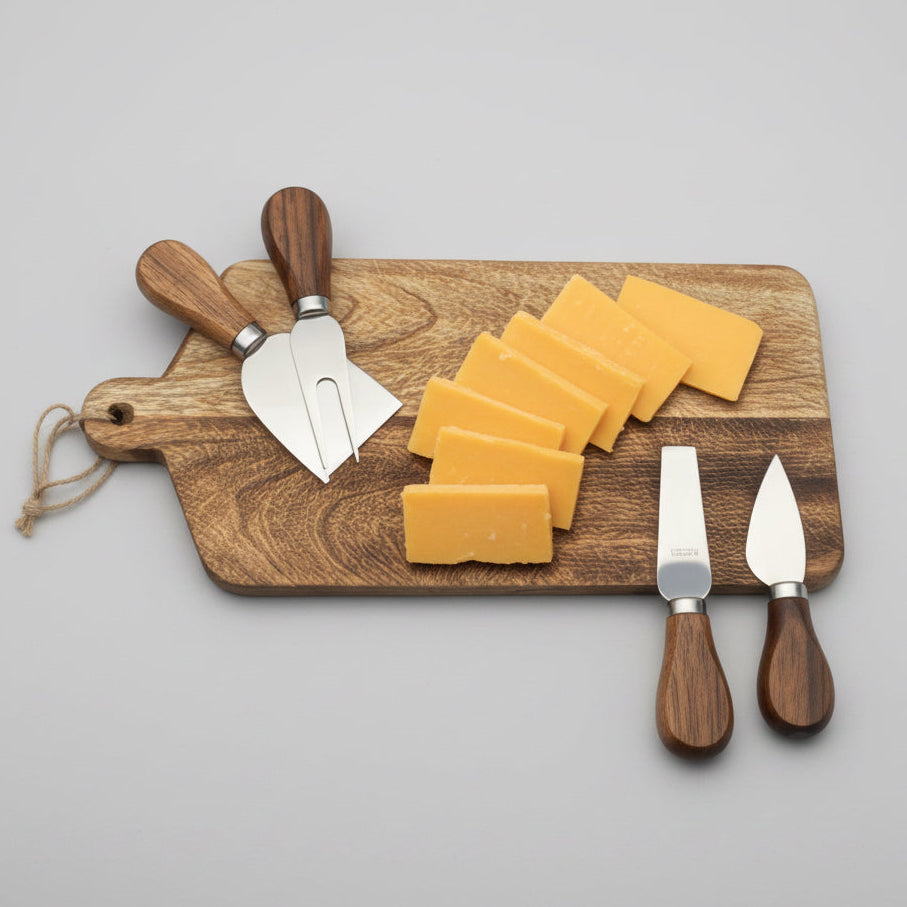 Wooden cutting board with cheese slices and knives on a white background